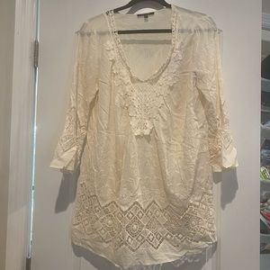 Cream top with crochet embellishments